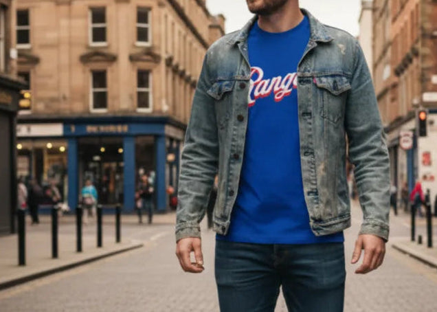 Man walking on a street in an urban setting with buildings and people in the background