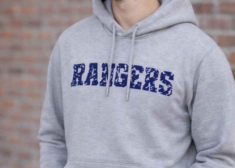 Gray hoodie with 'RANGERS' text on a brick wall background